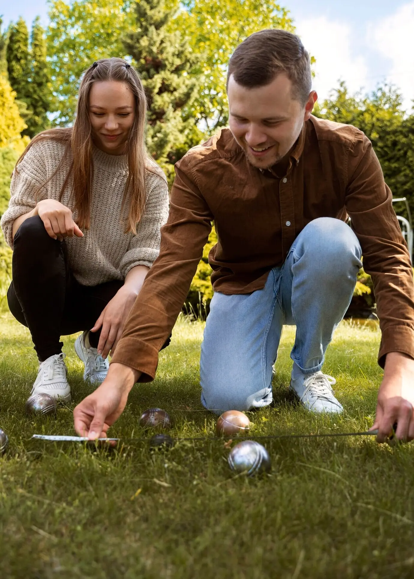 Low-angle view of a man measuring distance